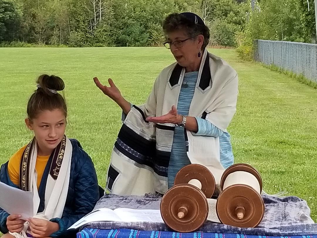 Rabbi Suri officiating a teen girl's Bat Mitzvah ceremony outdoors